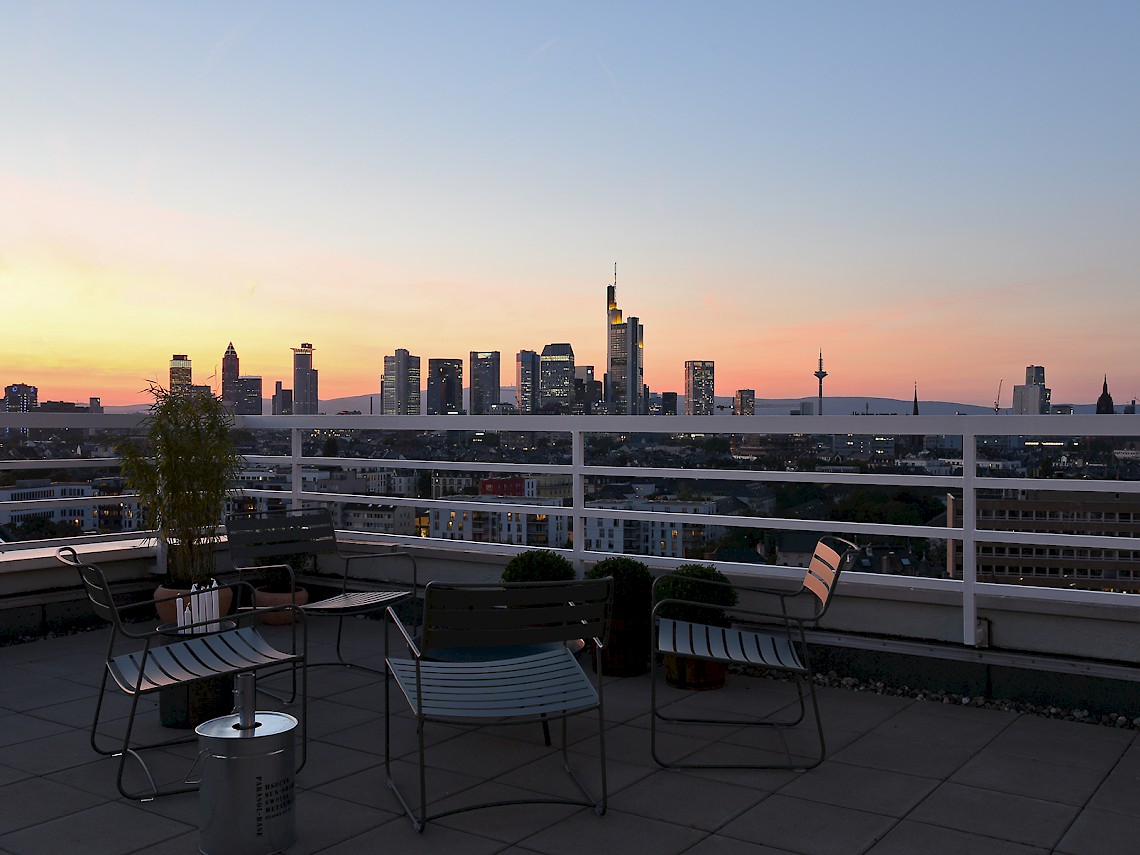 Terrace lounge and sunset over Frankfurt